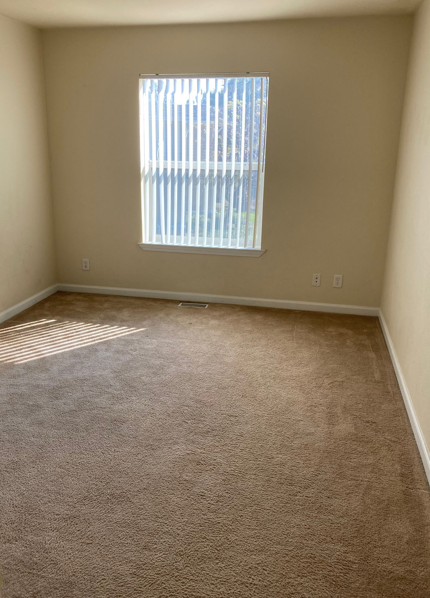 Bedroom with window and outlets